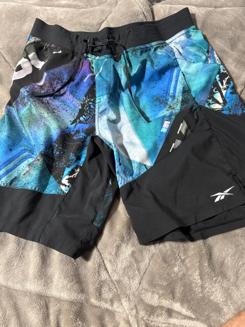 Reebok Men’s Black and Blue Graphic Athletic Shorts
